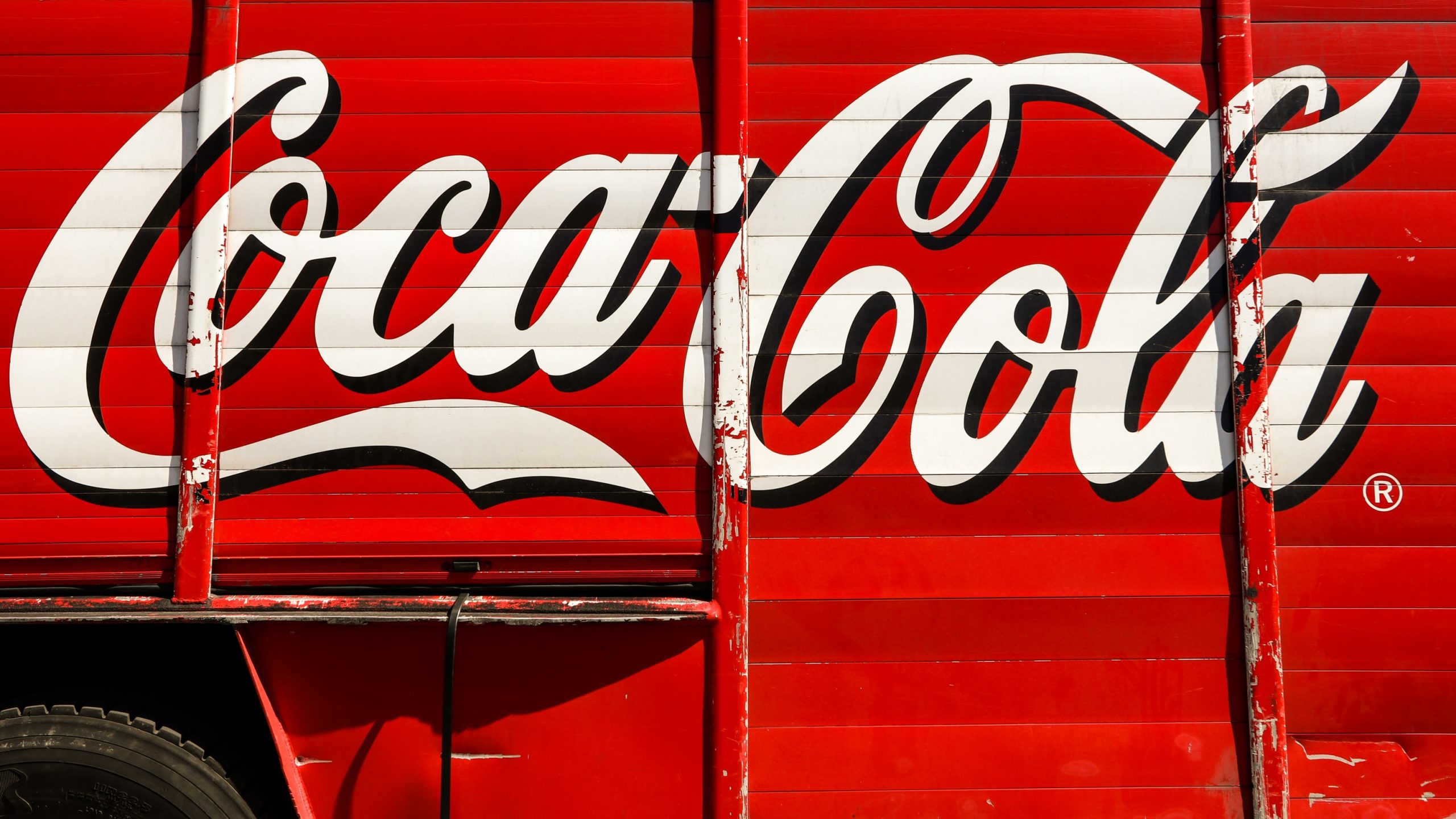 Coca Cola logo on the side of a van