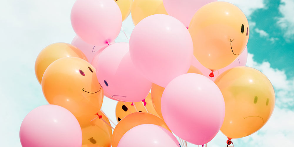 balloons with smiley faces on