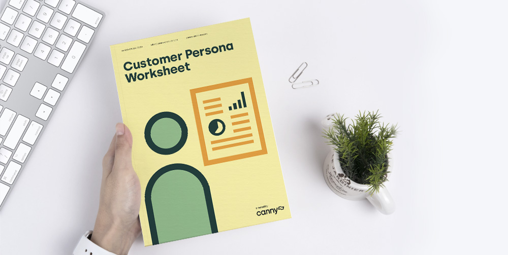 person holding customer persona worksheet