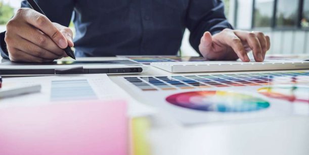 person looking at colour swatches