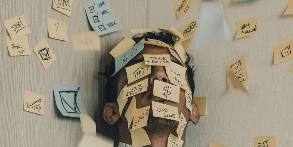 man covered in sticky notes