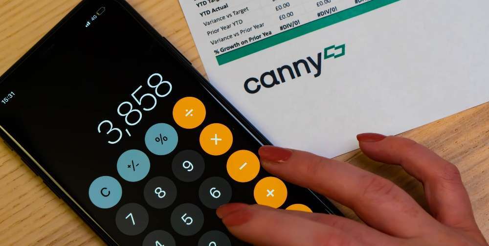 person using iPhone calculator