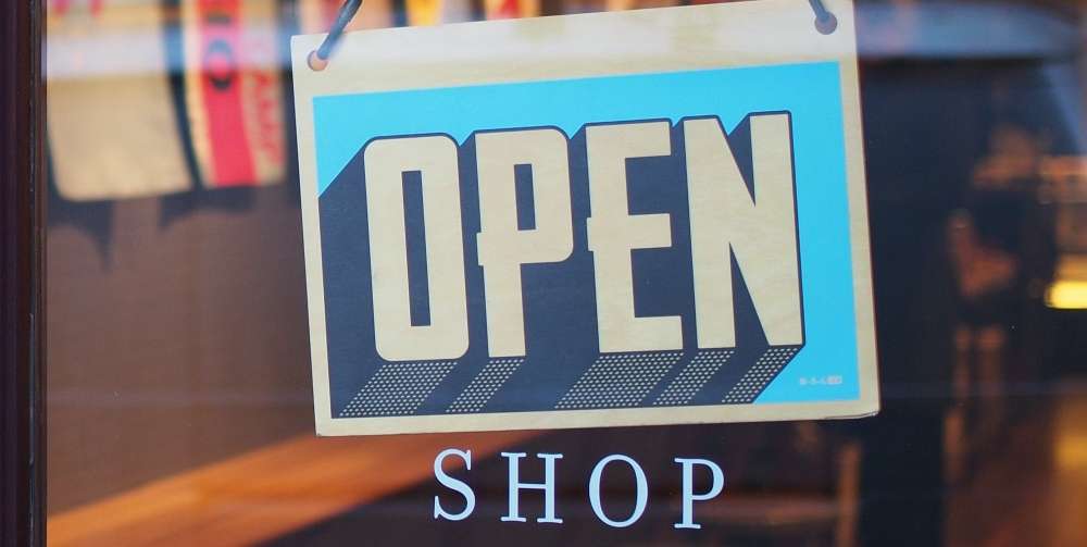 open shop sign on blue paper