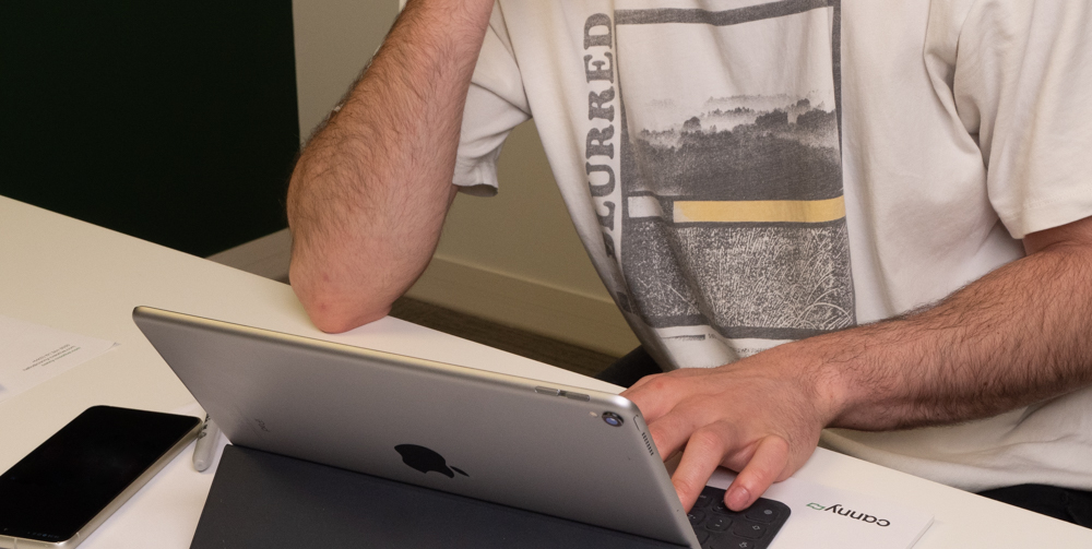 man typing on laptop