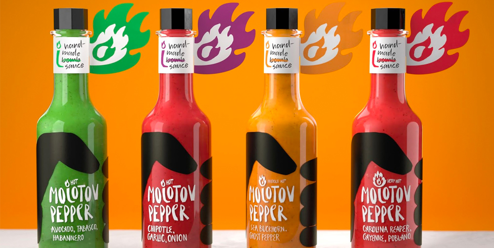 Four bottles of Molotov Pepper hot sauce sitting in a row