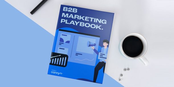 blue B2B marketing playbook next to cup of coffee