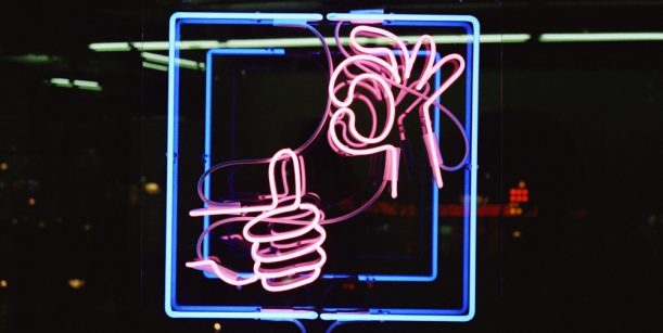 Neon sign thumbs up thumbs down