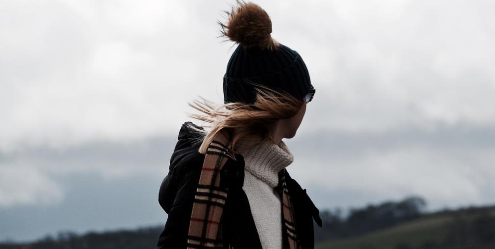 Burberry scarf being worn by a woman on a hike