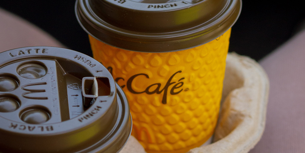Photograph of new McCafe brand identity on a paper cup