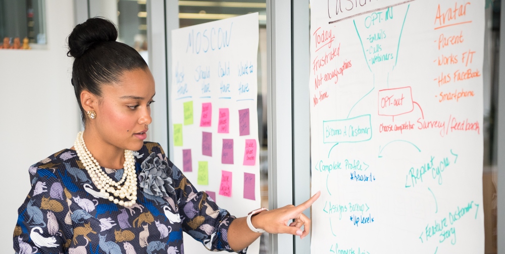 woman pointing to plan