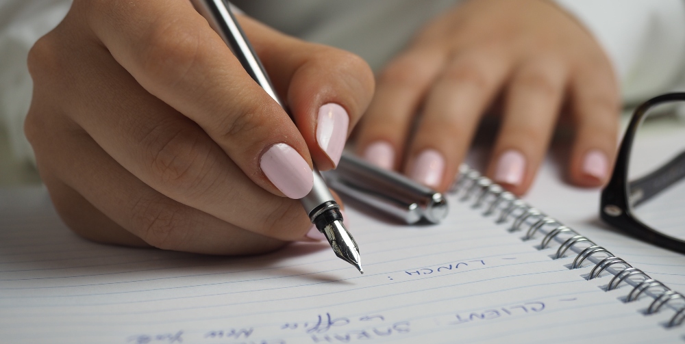 person writing list
