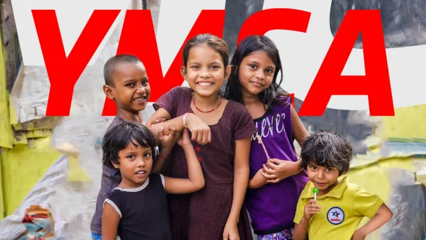 YMCA image of kids in front of logo.