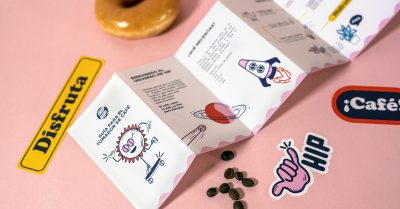 Branded collateral design laying on a desk.